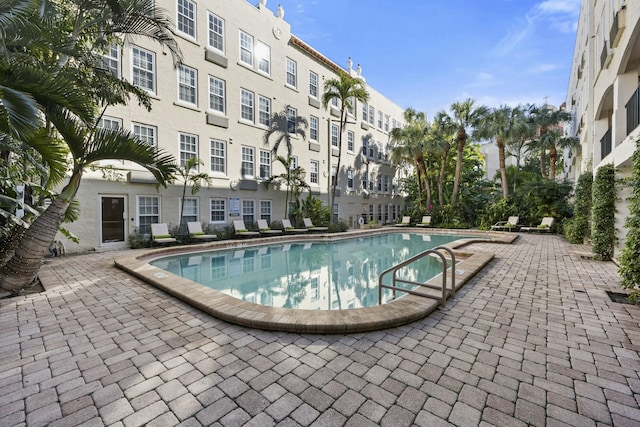 view of swimming pool featuring a patio area