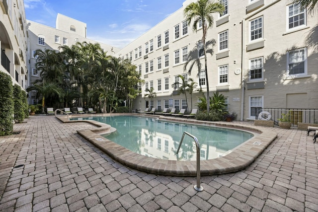 view of swimming pool featuring a patio area