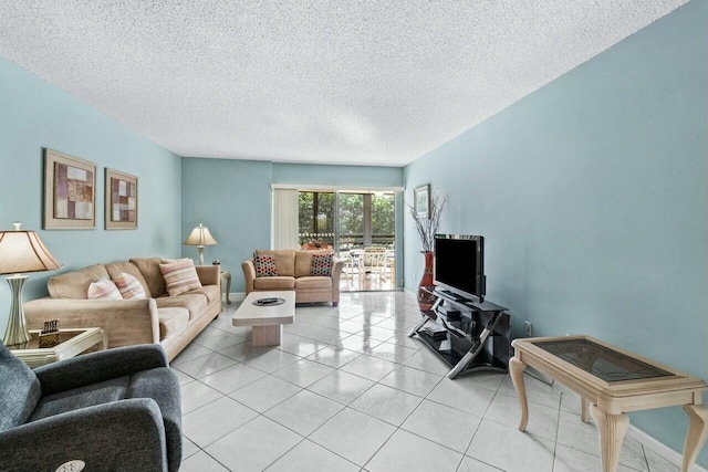 tiled living room featuring a textured ceiling