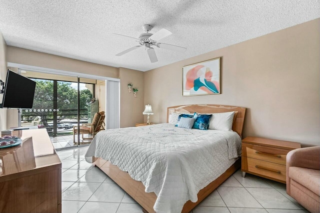 tiled bedroom featuring a textured ceiling, access to outside, and ceiling fan