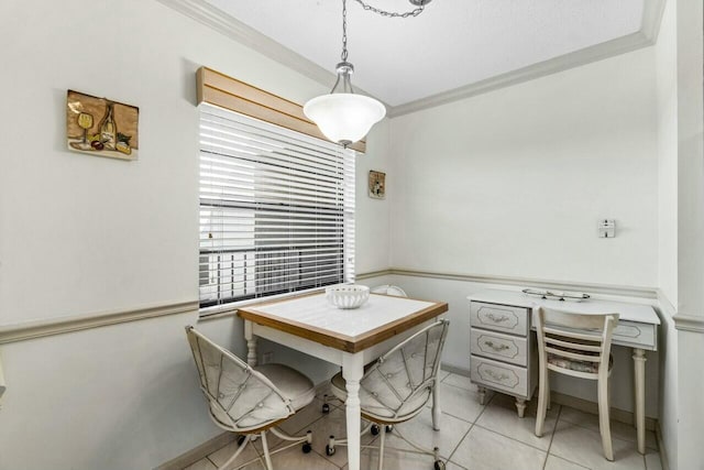 dining area with ornamental molding and light tile patterned floors