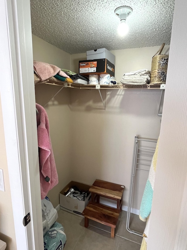 walk in closet featuring tile patterned floors