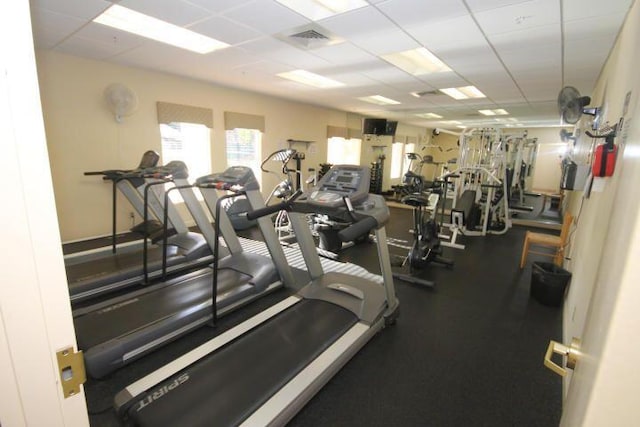 workout area featuring a drop ceiling