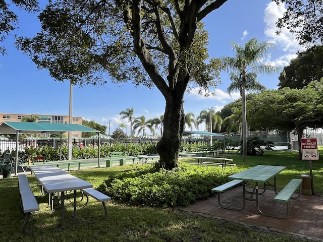 view of home's community with a yard