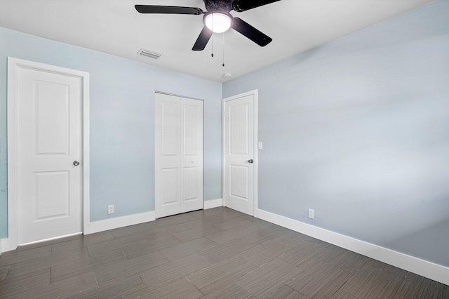 unfurnished bedroom featuring ceiling fan