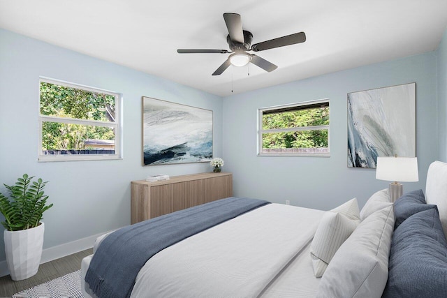 bedroom featuring hardwood / wood-style floors and ceiling fan