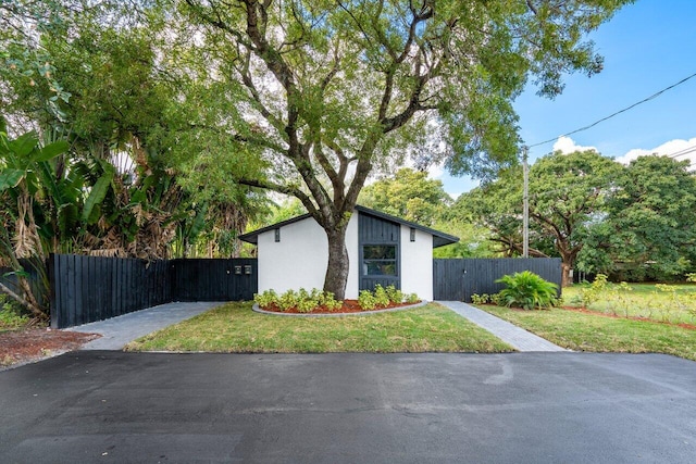 view of side of home featuring a lawn