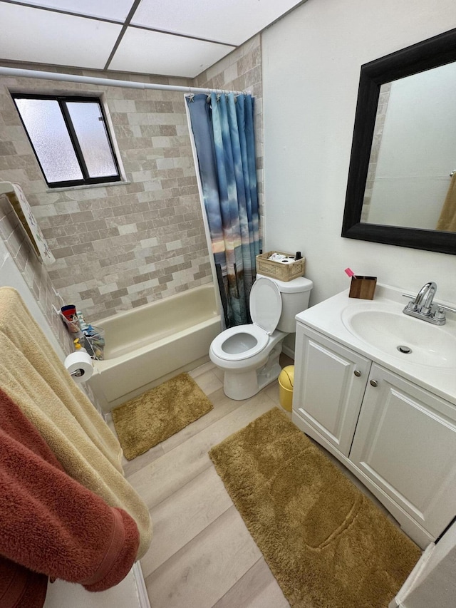 full bathroom featuring toilet, vanity, shower / bath combo, and hardwood / wood-style flooring