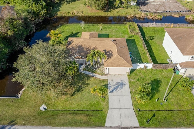 birds eye view of property with a water view