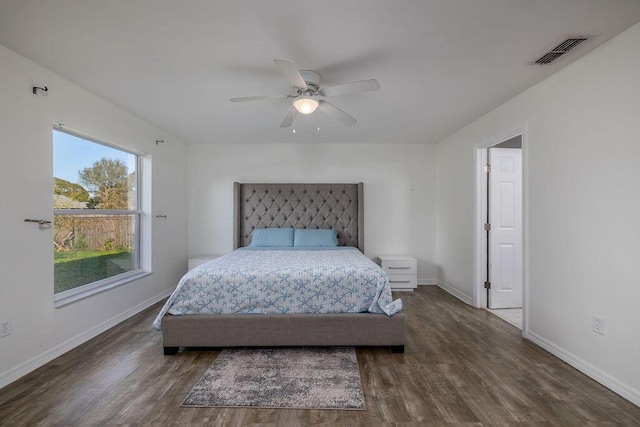 bedroom featuring ceiling fan and dark hardwood / wood-style flooring