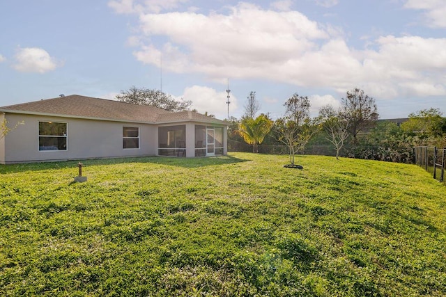 view of yard with a sunroom