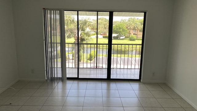 doorway featuring light tile patterned flooring