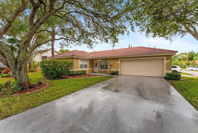 ranch-style home with a garage and a front yard