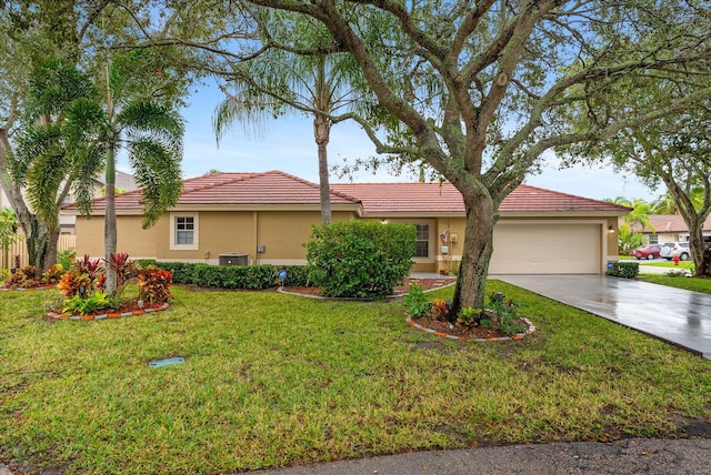 view of front of home with central AC unit, a garage, and a front lawn