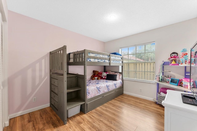 bedroom with light wood-type flooring