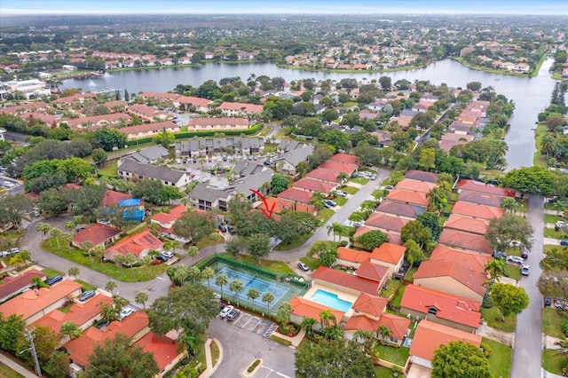 birds eye view of property featuring a water view