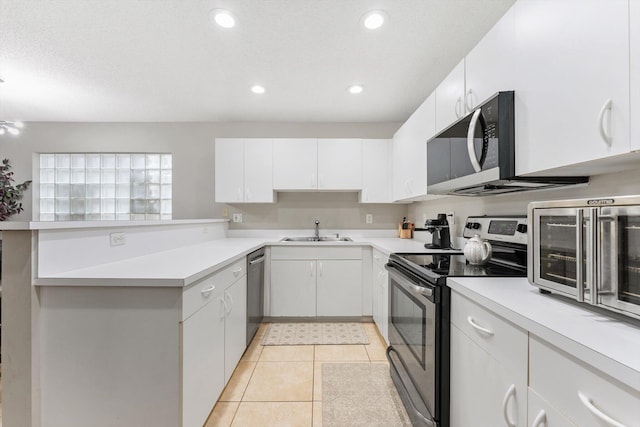 kitchen featuring sink, white cabinets, and stainless steel appliances