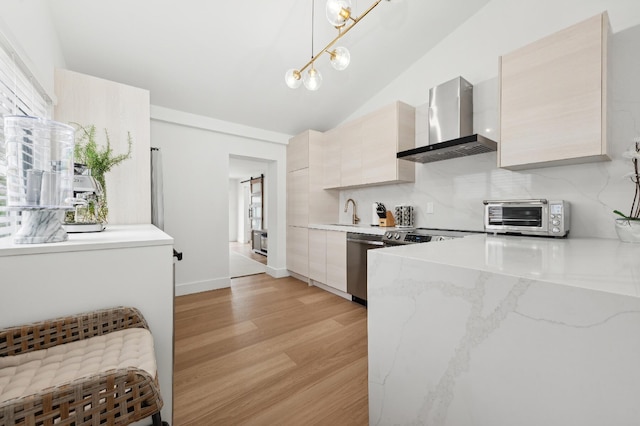 kitchen with dishwasher, wall chimney exhaust hood, backsplash, pendant lighting, and light wood-type flooring