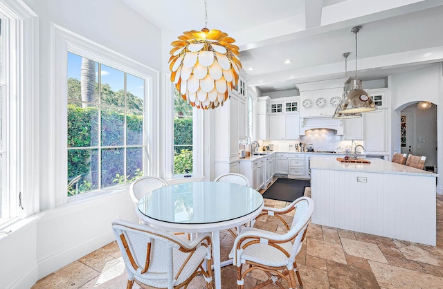 dining space featuring sink