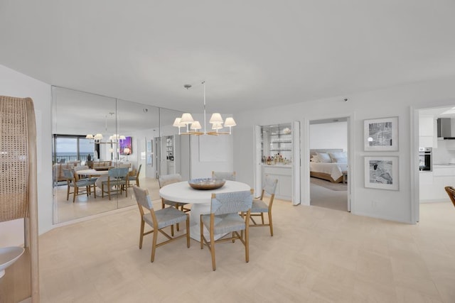 dining room with a notable chandelier