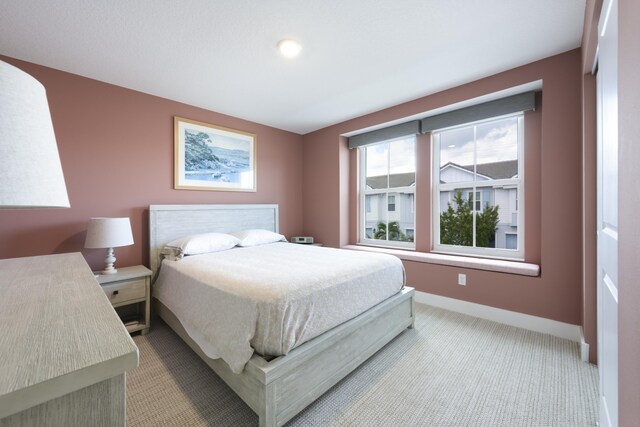 bedroom with light carpet