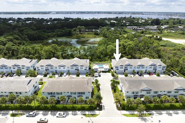 birds eye view of property featuring a residential view and a water view