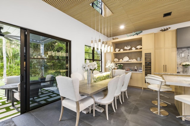 dining room featuring dark tile patterned flooring