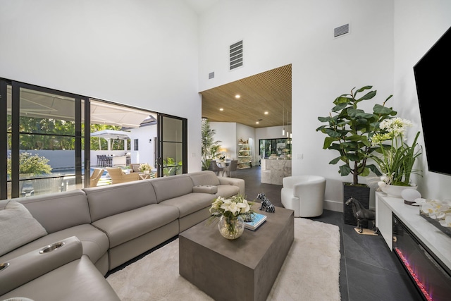 living room featuring a high ceiling