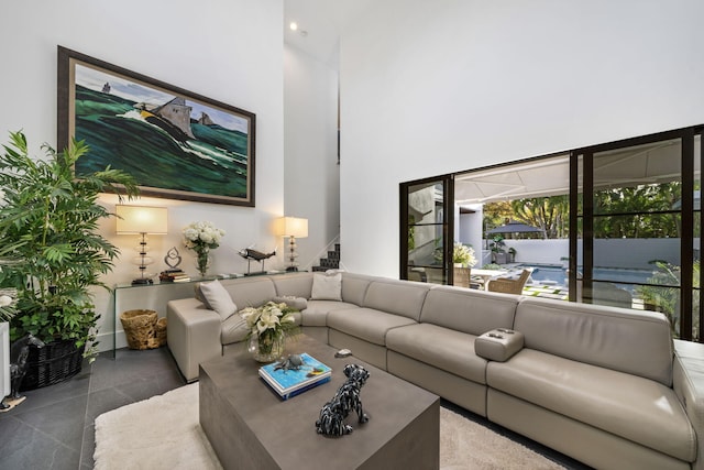 living room with a towering ceiling