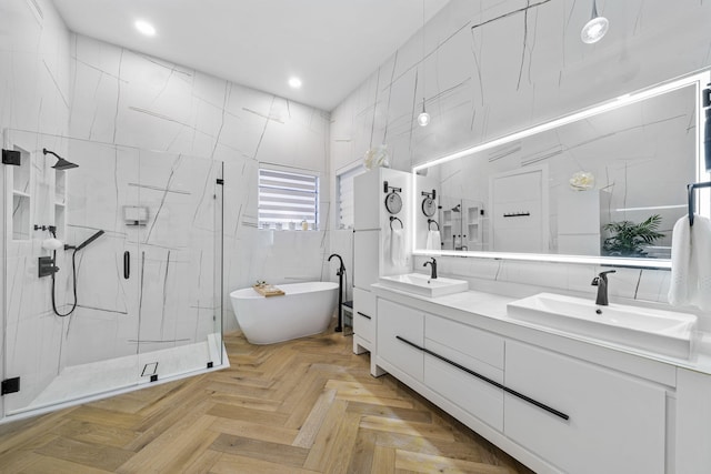 bathroom featuring parquet floors, tile walls, vanity, and shower with separate bathtub