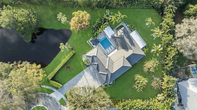 birds eye view of property with a water view