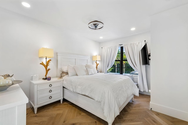 bedroom featuring light parquet flooring