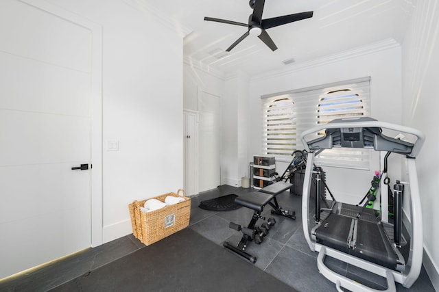 workout area featuring ceiling fan and crown molding