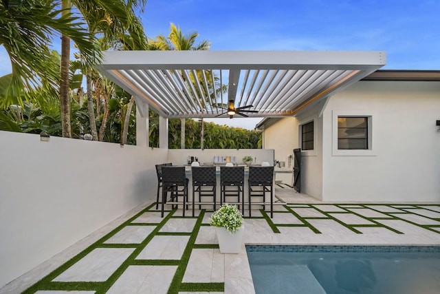 view of patio / terrace with a fenced in pool, a pergola, and exterior bar