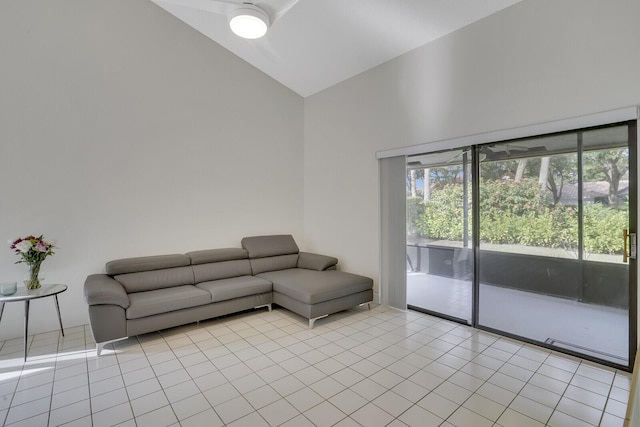 unfurnished living room with lofted ceiling and light tile patterned floors