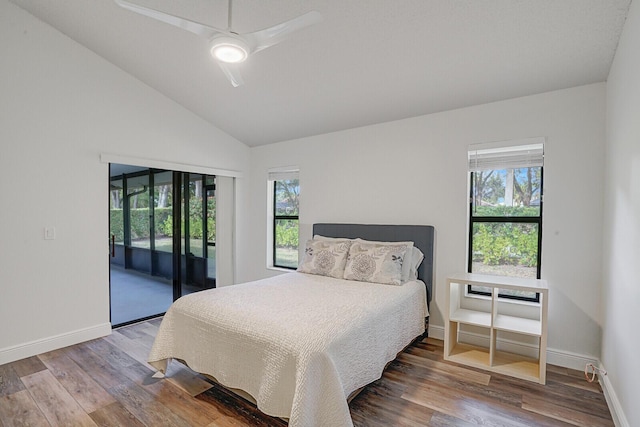 bedroom featuring access to outside, multiple windows, ceiling fan, and wood-type flooring