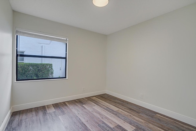 spare room with light hardwood / wood-style floors