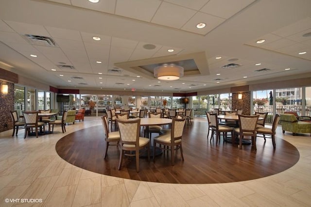 dining area with hardwood / wood-style floors and a wealth of natural light