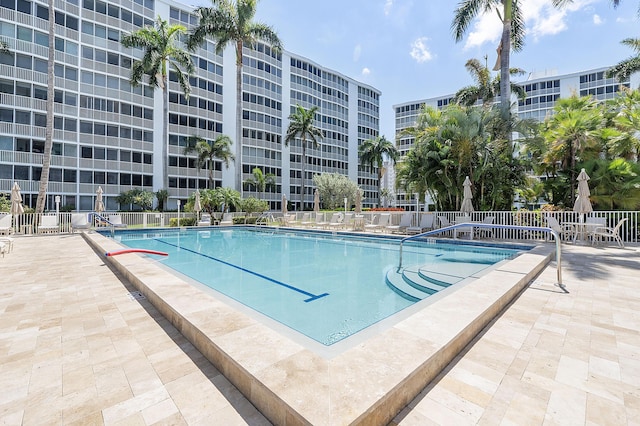 view of swimming pool featuring a patio area