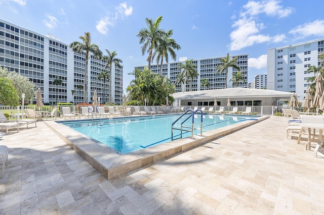 view of swimming pool featuring a patio area