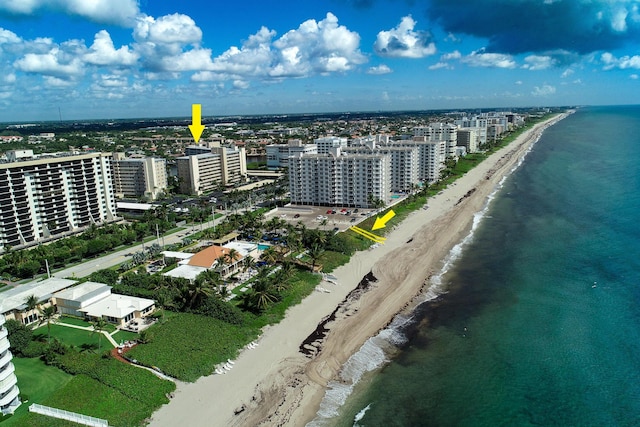 bird's eye view with a water view and a view of the beach