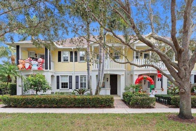 view of front of home with a balcony