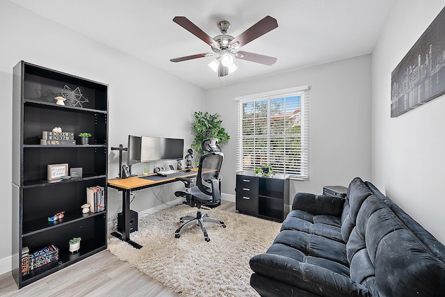 office space with ceiling fan and light hardwood / wood-style floors