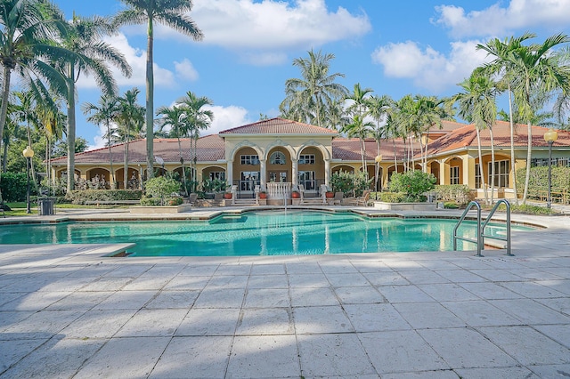 view of swimming pool with a patio area