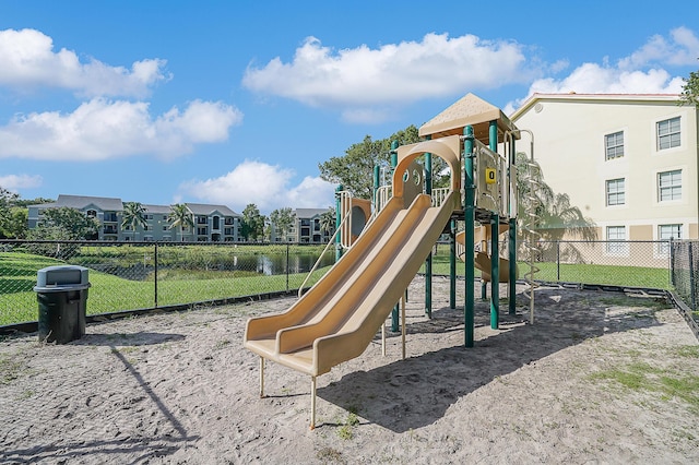 view of play area with a water view