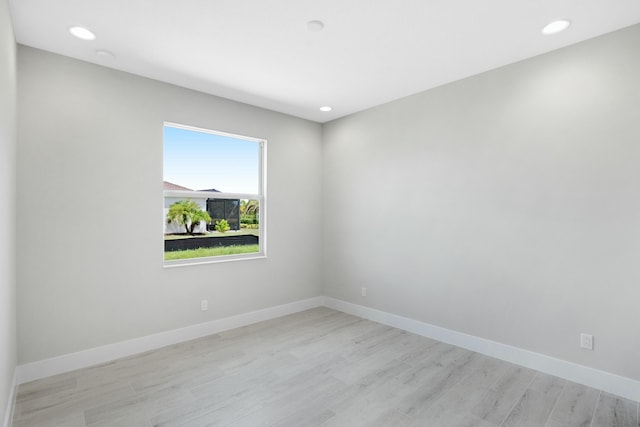 spare room featuring light hardwood / wood-style floors