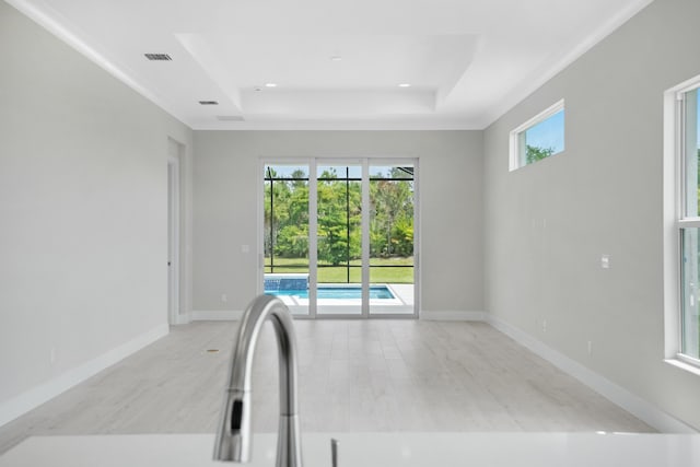 interior space with a tray ceiling