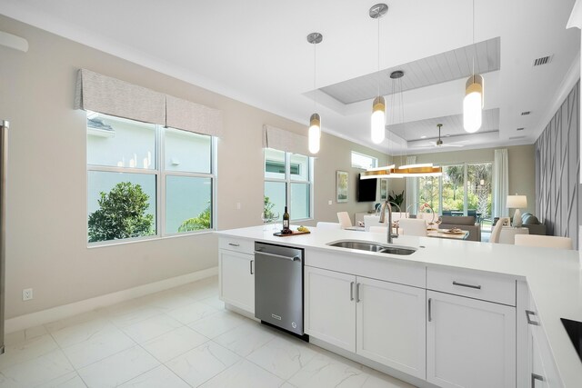 empty room with light hardwood / wood-style flooring and a tray ceiling