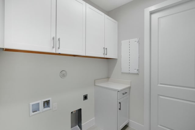 clothes washing area featuring washer hookup, electric dryer hookup, and cabinets