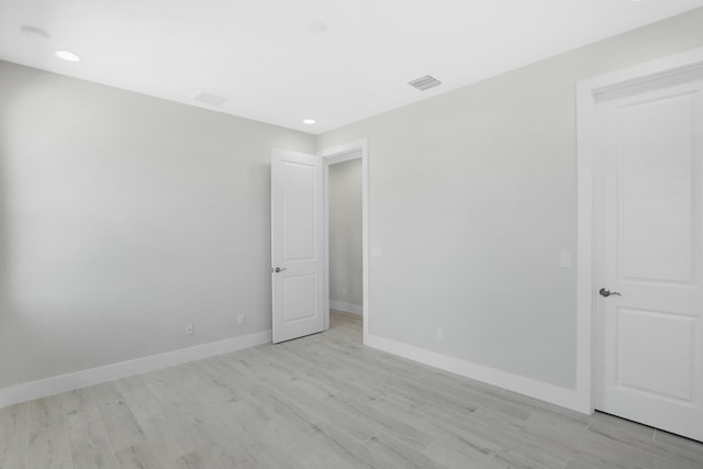 spare room featuring light hardwood / wood-style flooring